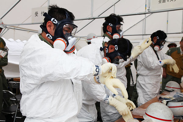 Training of putting on radiation protection gear (photo)